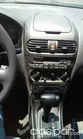 Nissan Sunny 2004 — foto 7