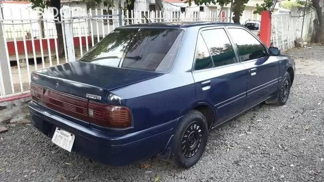 Mazda 323 1997 — foto 7
