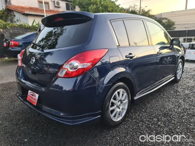 Nissan Tiida 2010 — foto 7