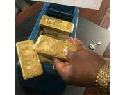 Venta de lingotes y polvo de oro.