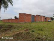 Vendo 4 terrenos juntos con edificación p/Hospedaje a estrenar en Caaguazu