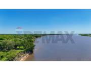 VENDO 1.400 HECTAREAS EN PILAR C/SALIDA DIRECTA AL RIO PY Y ORILLA PROPIA,FERTIL Y PLANO