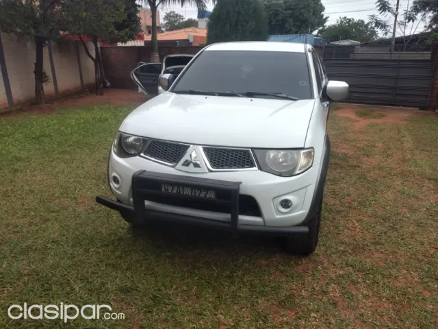 Mitsubishi L 200 2013 — foto 6
